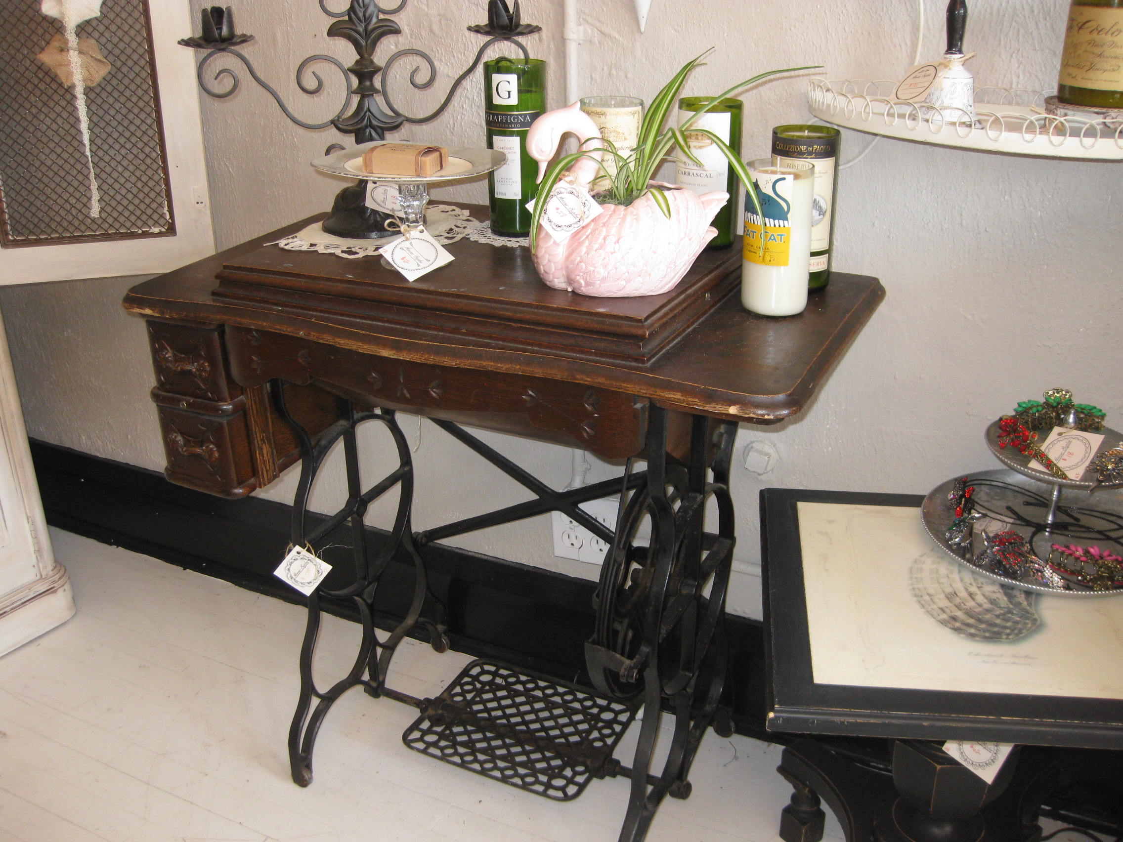 A classic sewing machine table - charming as is or ready to be refinished/repurposed